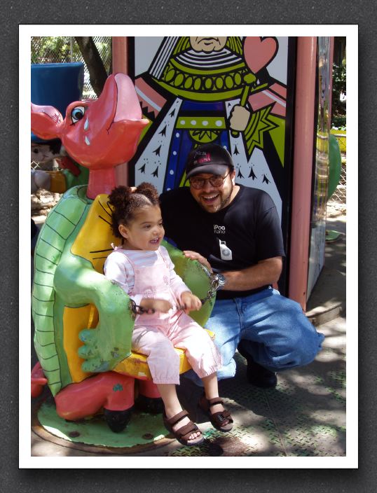 Kayla rides the Mock Turtle with Daddy
